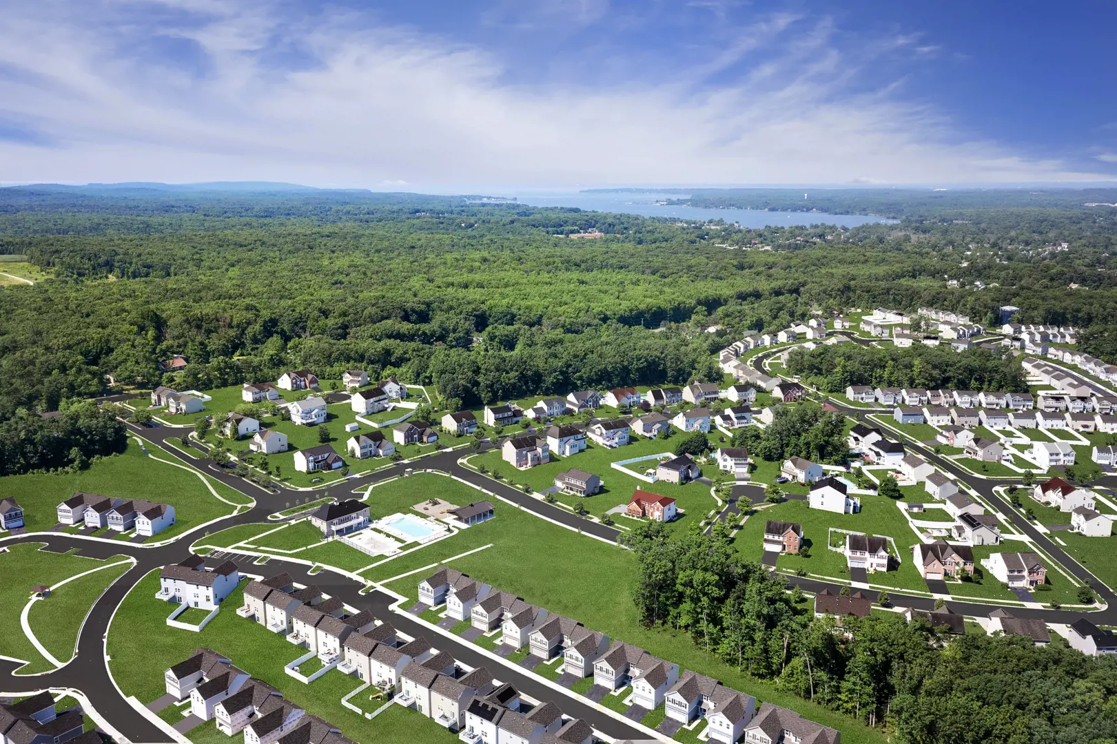 Wide aerial view of community with pool and lake